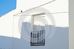 Stylish balcony with a metal railing, solid architectural element, a place of rest and relaxation, vintage decor