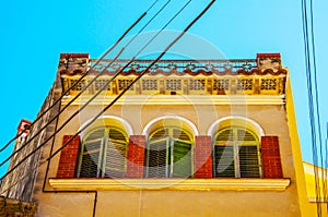 Stylish balcony with a metal railing, solid architectural element, a place of rest and relaxation, vintage decor