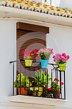 Stylish balcony with a metal railing, solid architectural element, a place of rest and relaxation, vintage decor