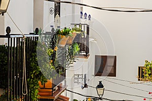 Stylish balcony with a metal railing, solid architectural element, a place of rest and relaxation vintage decor