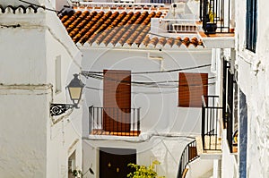 Stylish balcony with a metal railing, solid architectural element, a place of rest and relaxation, vintage decor