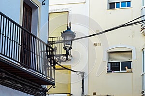 Stylish balcony with a metal railing, solid architectural element, a place of rest and relaxation, vintage decor