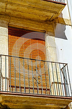 Stylish balcony with a metal railing, solid architectural element, a place of rest and relaxation, vintage decor