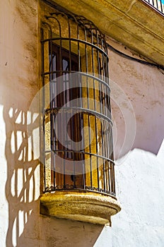 Stylish balcony with a metal railing, solid architectural element, a place of rest and relaxation, vintage decor