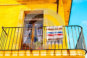 Stylish balcony with a metal railing, solid architectural element, a place of rest and relaxation, vintage decor