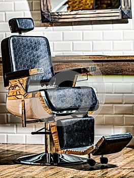 Stylish barber chair. Barbershop theme. Professional hairstylist in barbershop interior. Barber shop chair. Barbershop