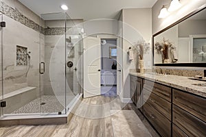 a stylish bathroom remodel with new fixtures, flooring and shower