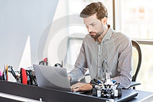 Stylish bearded man sitting in office