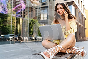 Stylish beautiful attractive woman using computer laptop