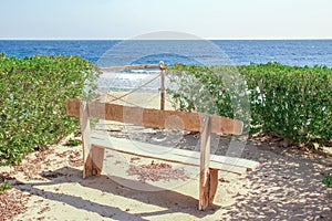 Stylish beautiful bench on nature near the sea background