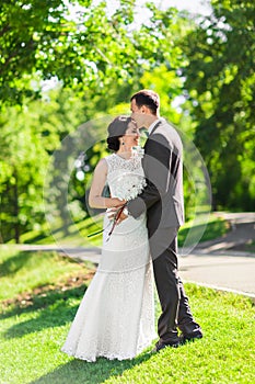 Stylish beautiful happy bride and groom, wedding celebrations outdoor