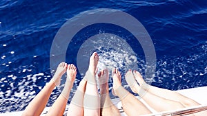 Stylish beautiful legs on a ship yacht in the sea background