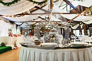 Stylish beautiful luxury wedding decor with a lot of flowers on