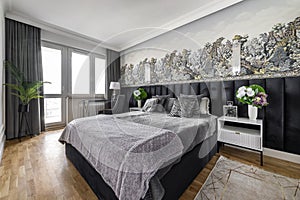 Stylish bedroom in gray finishing