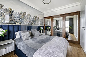 Stylish bedroom in gray finishing