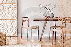 Stylish dining room in japandi interior design style. photo