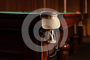 Stylish billiard table with pocket indoors, closeup