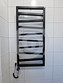 Stylish black electric towel dryer