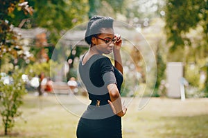 Stylish black girl in a park