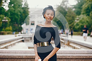 Stylish black girl in a park