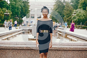 Stylish black girl in a park