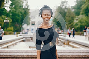 Stylish black girl in a park