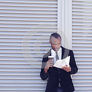 Stylish black man documents handling