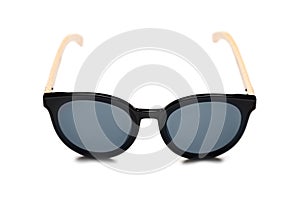 Stylish black sunglasses with a wooden frame isolated on white background