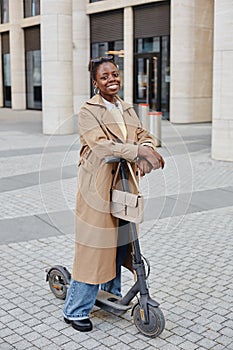 Stylish Black Woman With Scooter in City