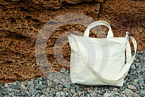 Stylish blank eco bag on sea stones outdoor