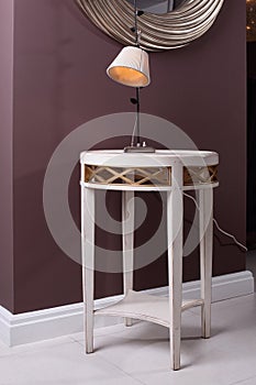 Stylish and brand new table with lamp and mirror