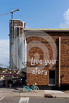 Stylish brick wall has graffiti message Live Your Story in Ottawa's Little Italy area. . Claridge Icon building under