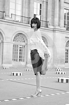 stylish brunette girl posing outside. stylish brunette girl in the street. stylish brunette girl model.