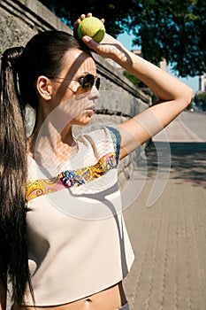 stylish brunette tennis player with racket