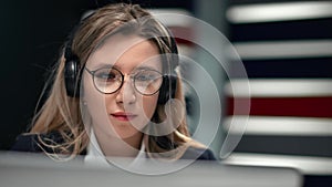 Stylish business lady in headset talking webcam video call use laptop. Closeup shot on 4k RED camera