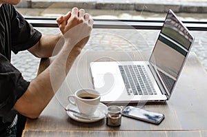 Stylish business man working on a laptop.