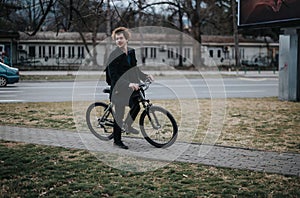Stylish businessman commuting by bicycle in an urban setting