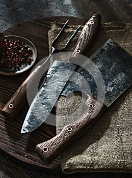 Stylish Butcher`s Set: cleaver, knife and fork. Top view