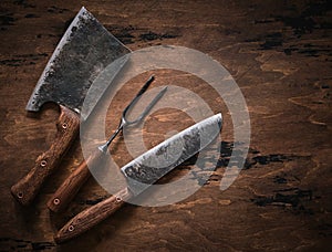 Stylish Butcher`s Set: cleaver, knife and fork. Top view