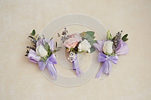Stylish buttonhole Wedding accessory bridesmaid on the table standing
