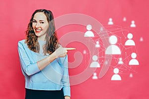 Stylish caucasian girl in a pale blue t-shirt on a pink background. Concept recruitment for work - HR