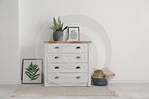 Stylish chest of drawers in living room