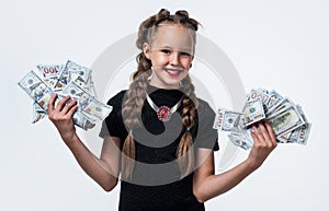 stylish child with retro look has money cash dollar in suitcase isolated on white, lottery winer