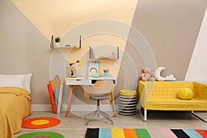 Stylish child room interior with bed and desk