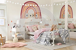 Stylish child`s room interior with comfortable bed