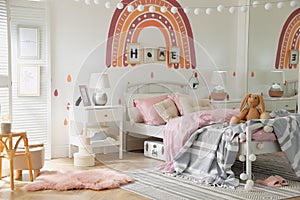 Stylish child`s room interior with comfortable bed