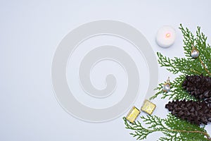 Stylish christmas composition. fir branches, cones and christmas decorations on white background. flat lay top view.