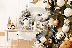 Stylish christmas living room interior with curved furniture, christmas tree and wreath