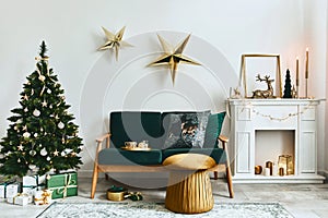 Stylish christmas living room interior with green sofa, white chimney, christmas tree and wreath, stars, gifts and decoration.