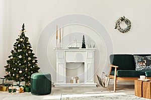 Stylish christmas living room interior with green sofa, white chimney, christmas tree and wreath, gifts and decoration.